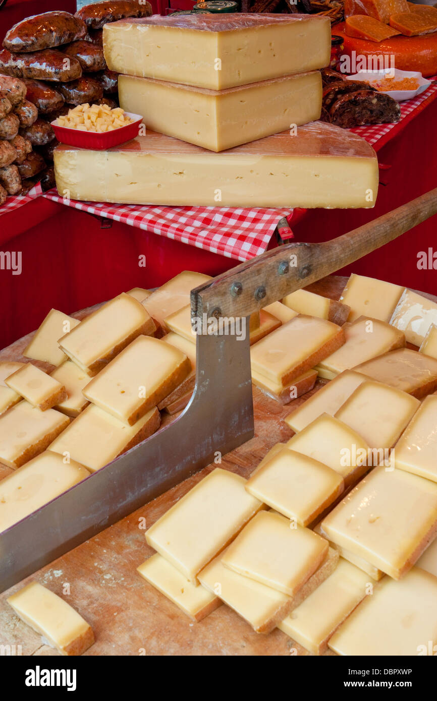 Cheese for Sale and an Old Cutter or Chopper Used for Slicing Cheeses in a  Market at Salzburg Stock Image - Image of court, industry: 88882183