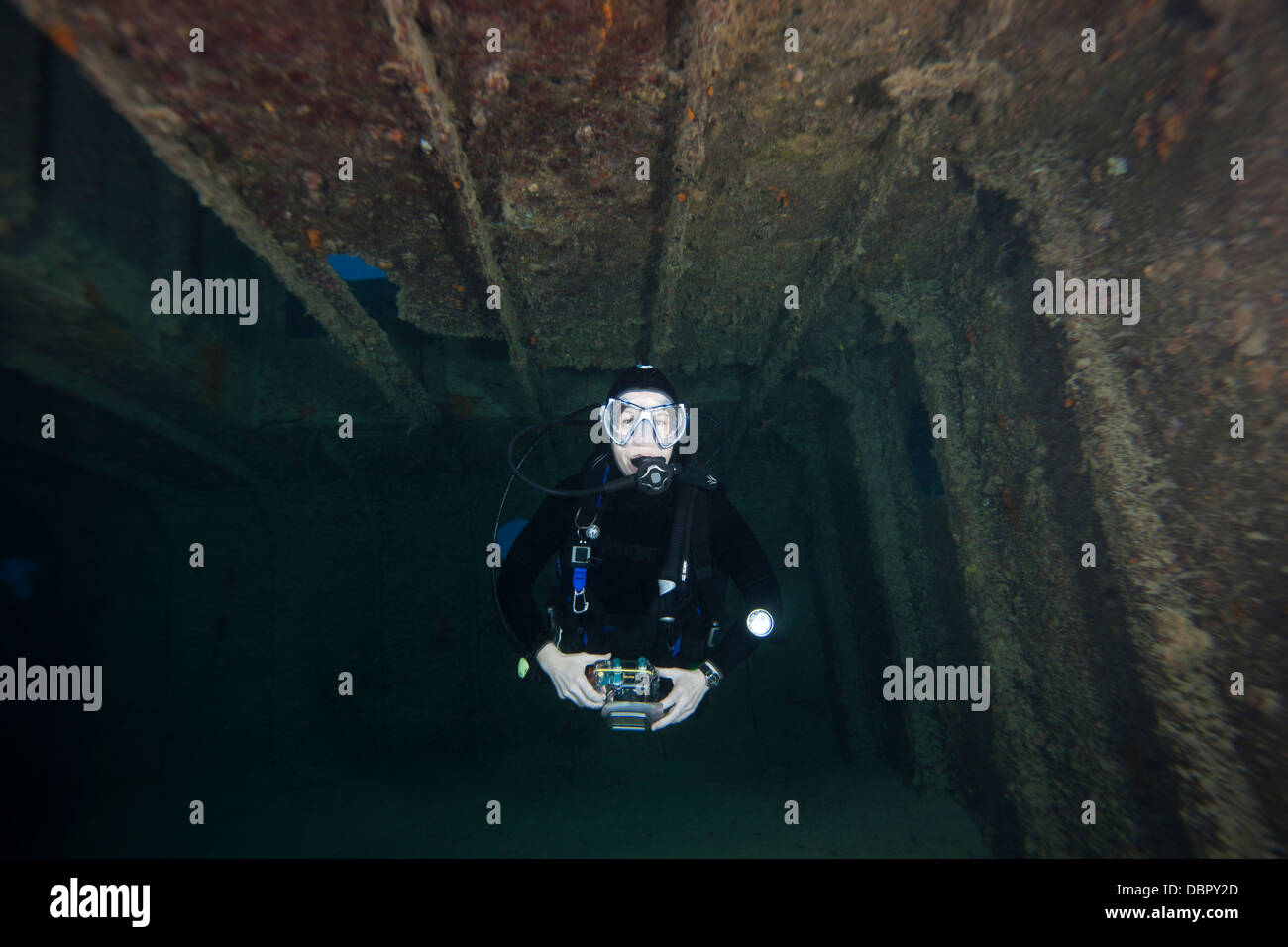 Scuba diver inside the Prince Albert Wreck off the island of Roatan, Honduras. Stock Photo