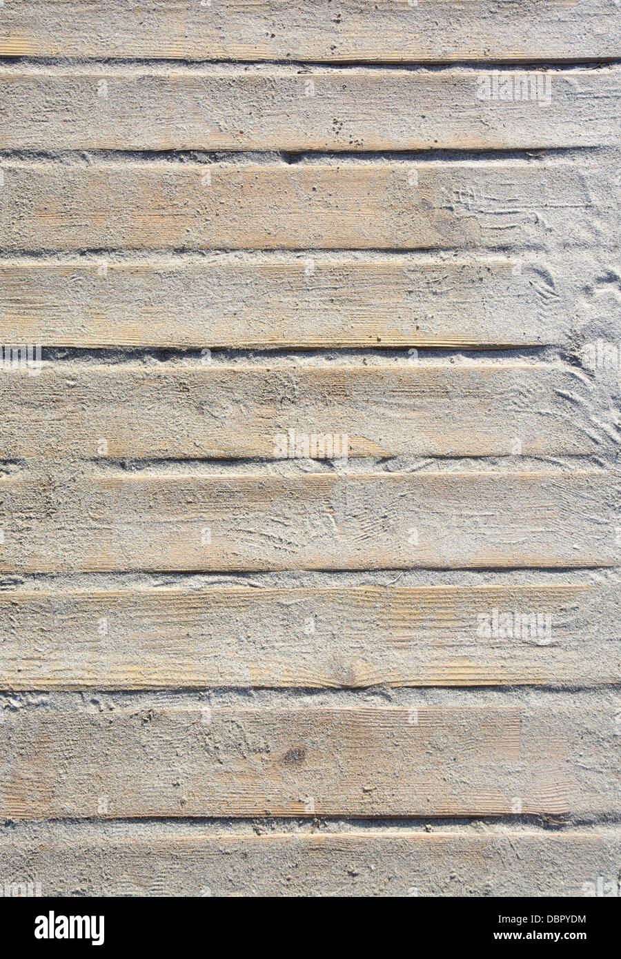 Wooden plank beach boardwalk with sand vertical image for texture