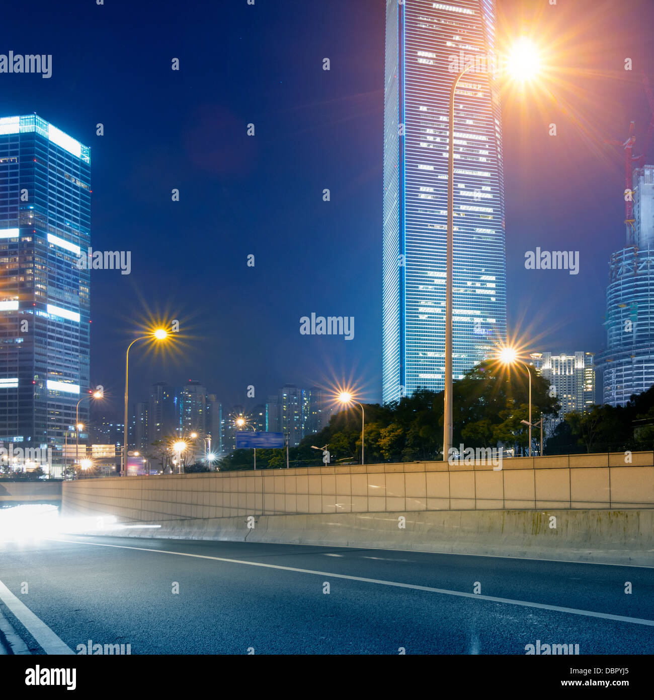 light trails on the street with modern building background in shanghai ...