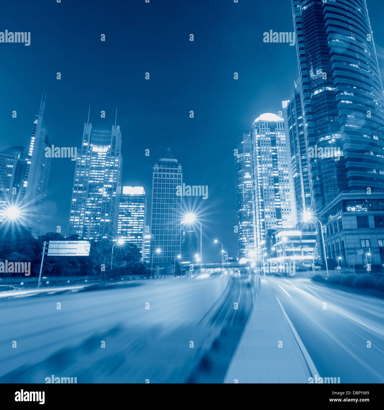 light trails on the street with modern building background in shanghai ...