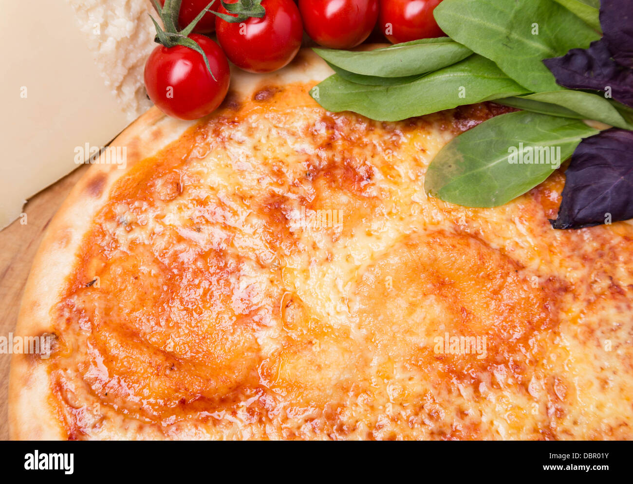 hot pizza with garnish and ingredients Stock Photo Alamy