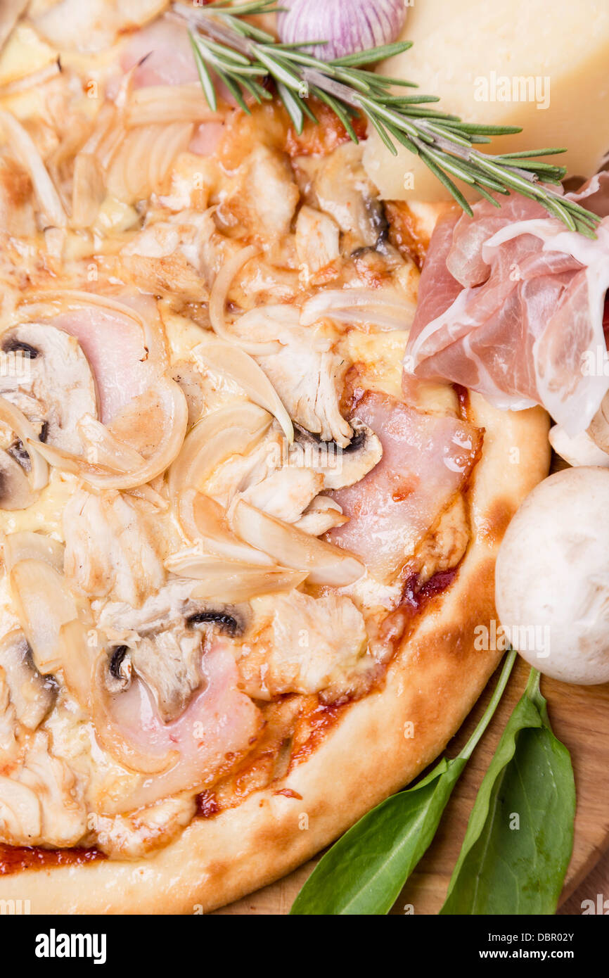 hot pizza with garnish and ingredients Stock Photo Alamy