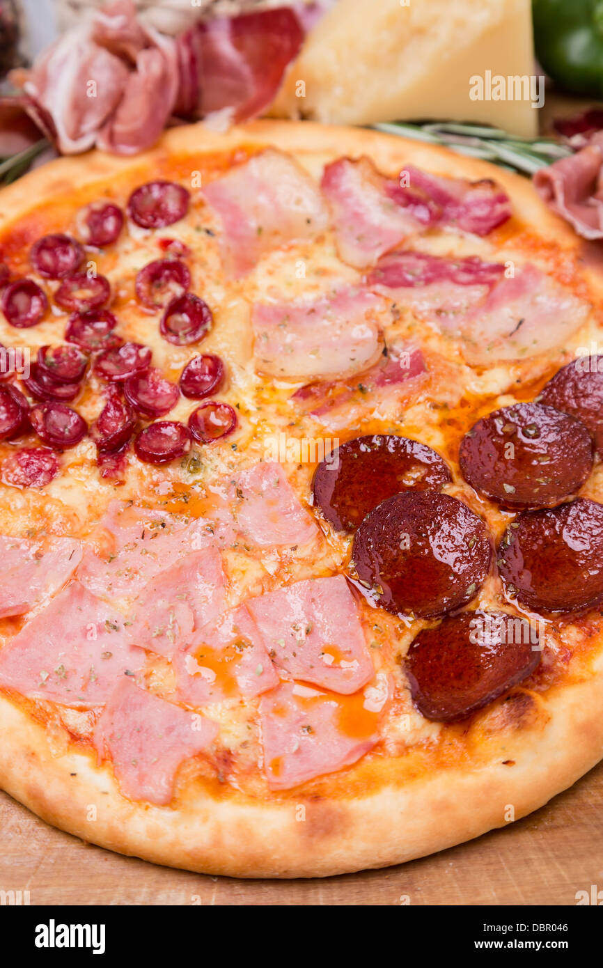 hot pizza with garnish and ingredients Stock Photo Alamy