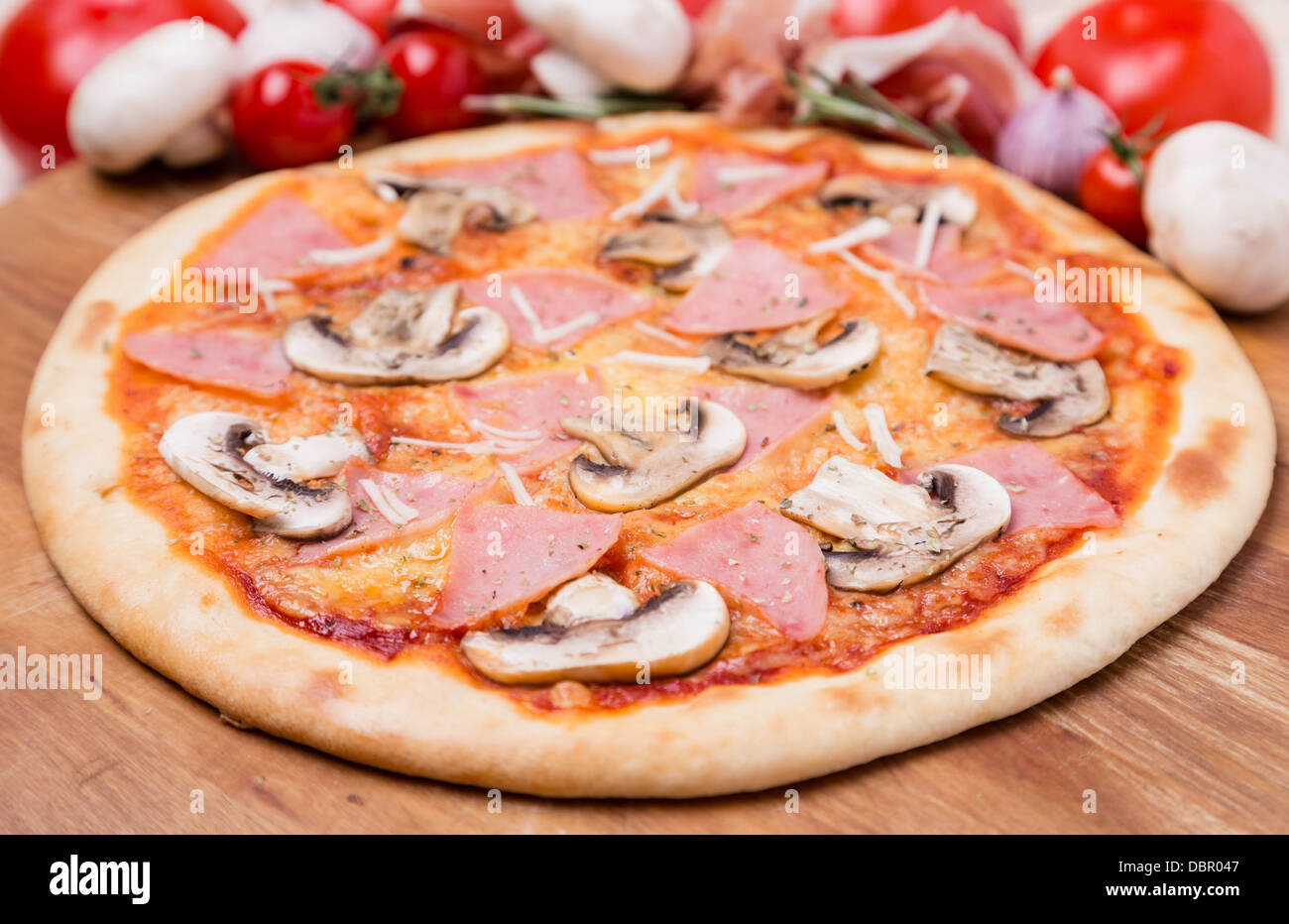 hot pizza with garnish and ingredients Stock Photo Alamy