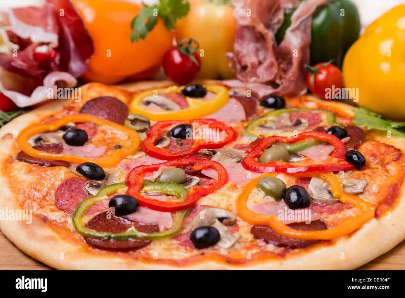 hot pizza with garnish and ingredients Stock Photo Alamy