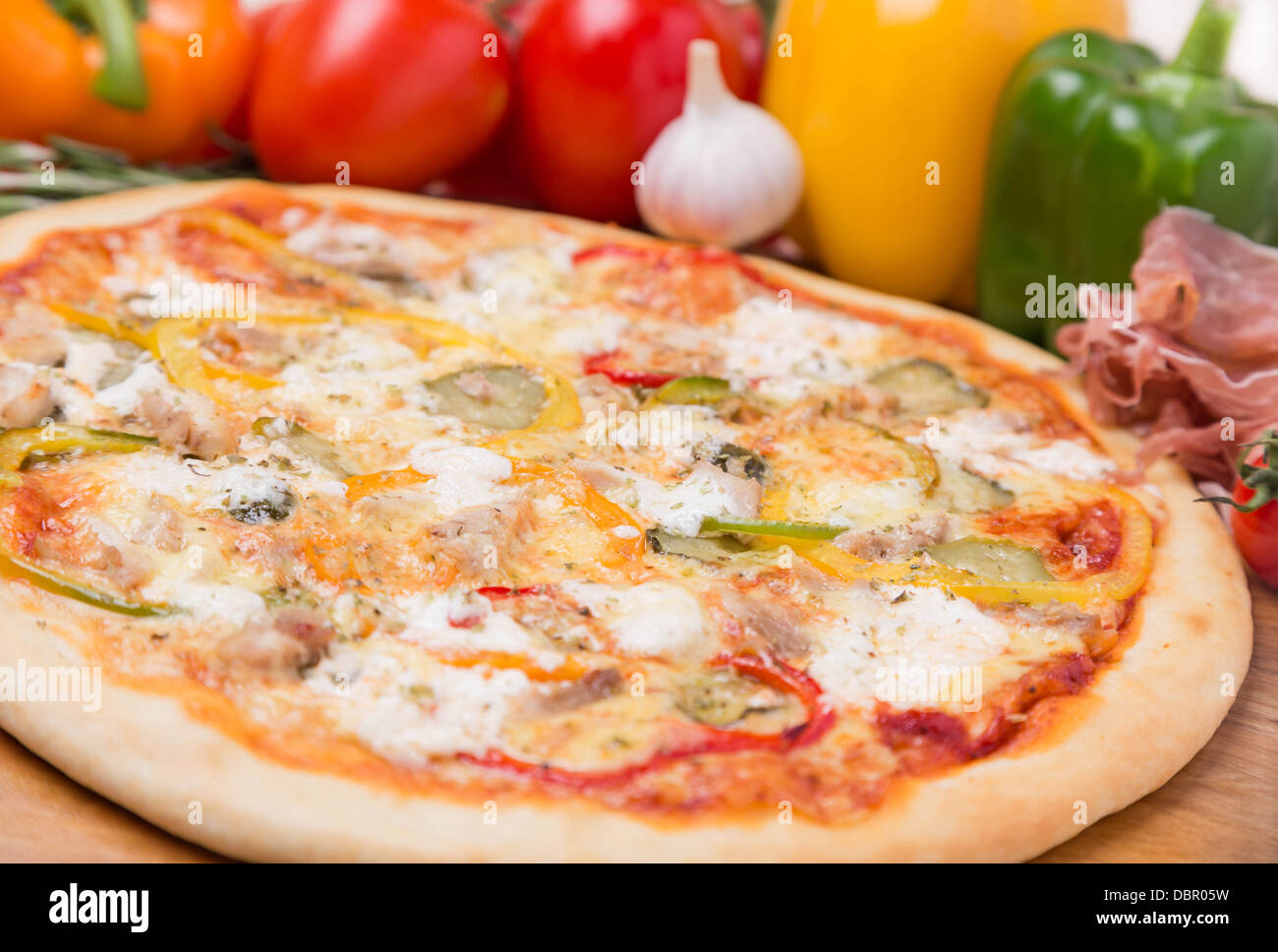 hot pizza with garnish and ingredients Stock Photo Alamy