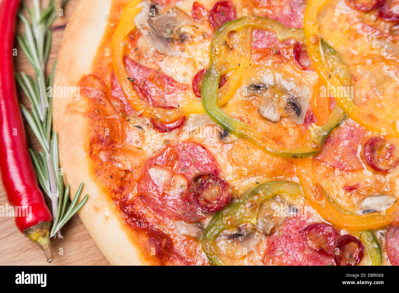 hot pizza with garnish and ingredients Stock Photo Alamy