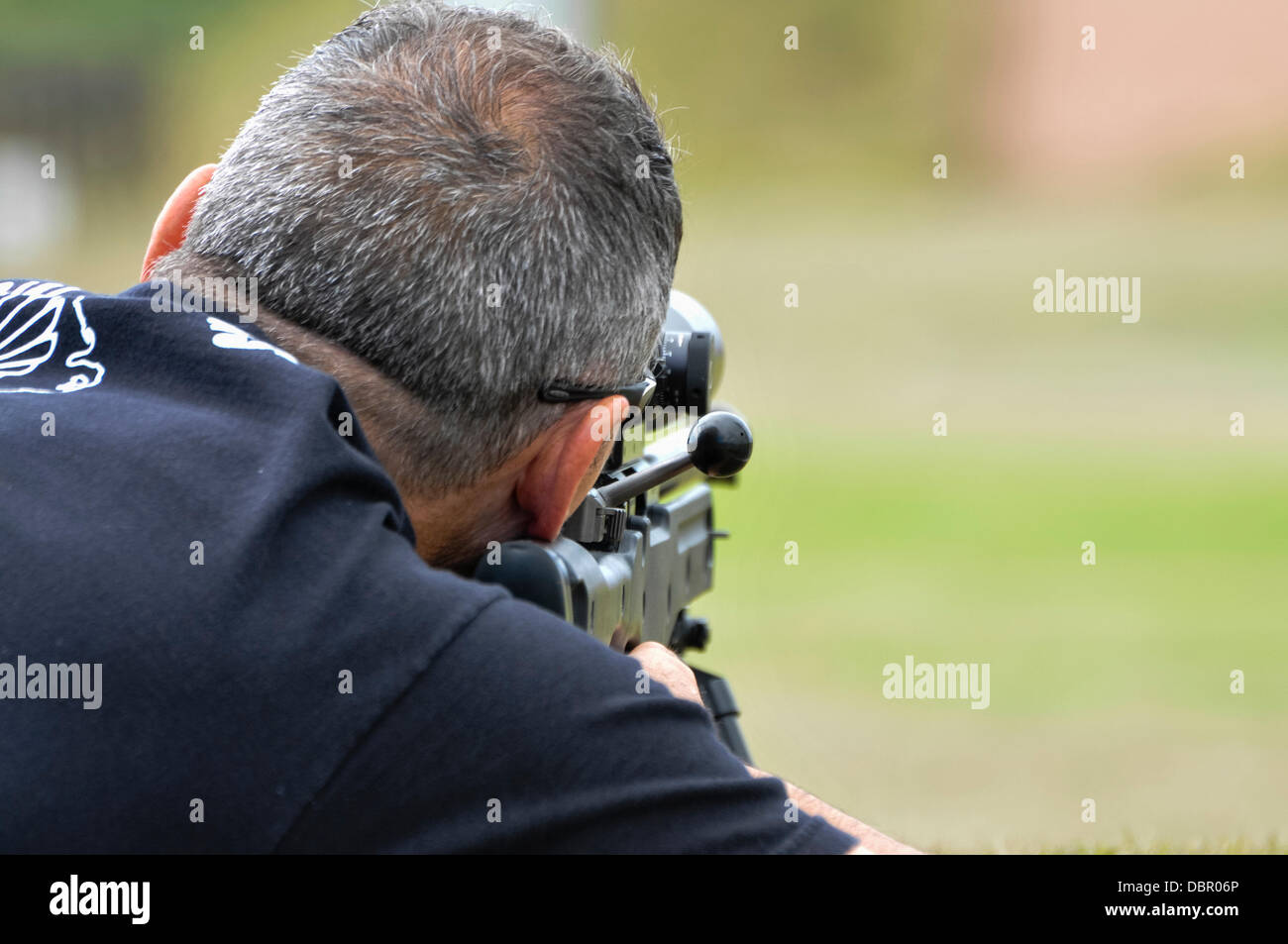 Ballykinlar, Northern Ireland. 2nd August 2013 - A man fires a Remington 700P bolt-action sniper rifle Credit:  Stephen Barnes/Alamy Live News Stock Photo