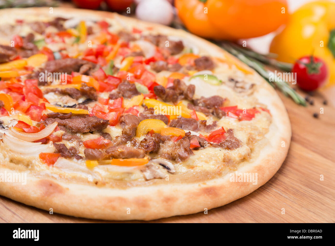 hot pizza with garnish and ingredients Stock Photo Alamy