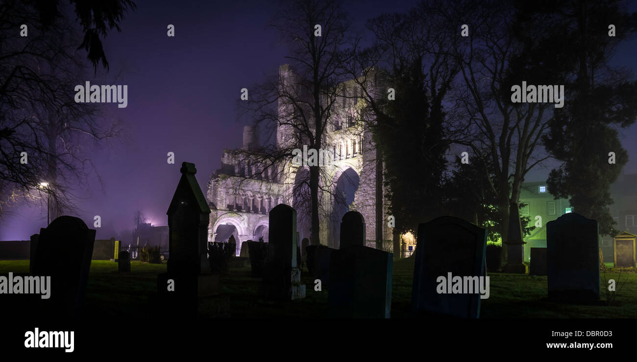 Kelso Abbey shot at night, as the mist slowly dispersed, in the Scottish Borders. Stock Photo