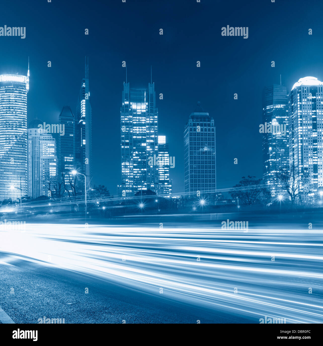 light trails on the street with modern building background in shanghai ...