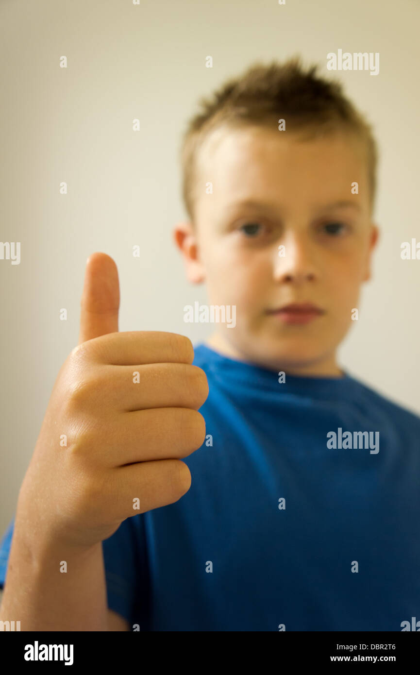 Boy holding his thumb up Stock Photo