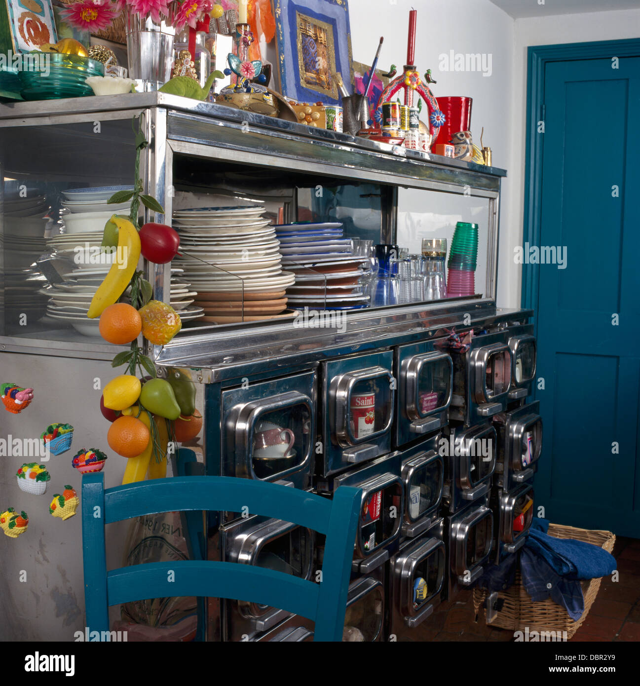 Stacks Of Plates On Fifties Metal Dresser With Storage Drawers And