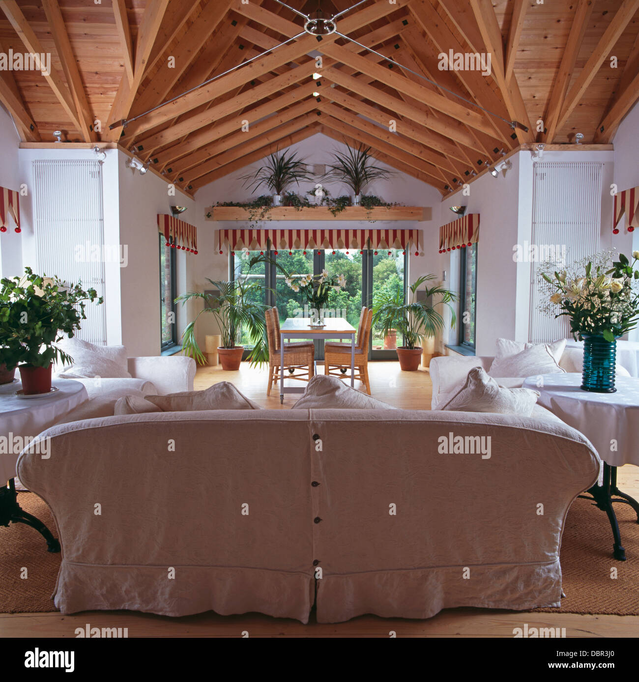 White Loose Cover On Sofa In Large Living And Dining Room