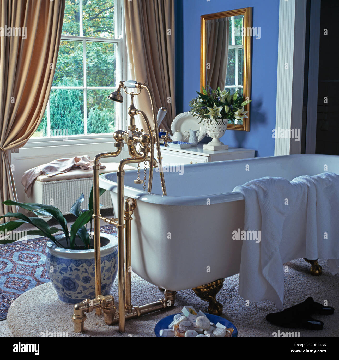 Freestanding Brass Taps And Roll Top Bath In Blue Country Bathroom