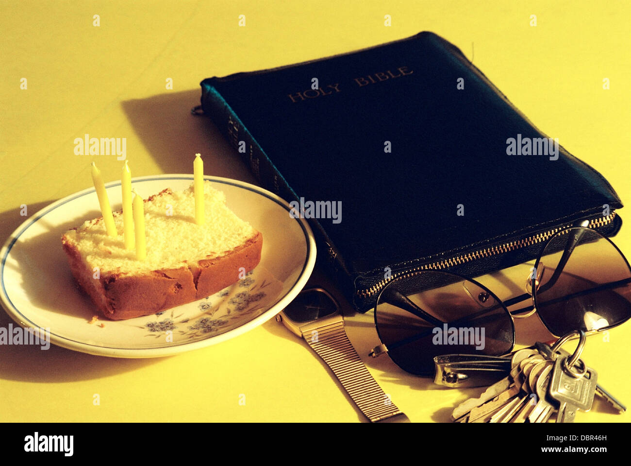 My birthday cake,at age thirty one,surrounded by essentials of life. Stock Photo