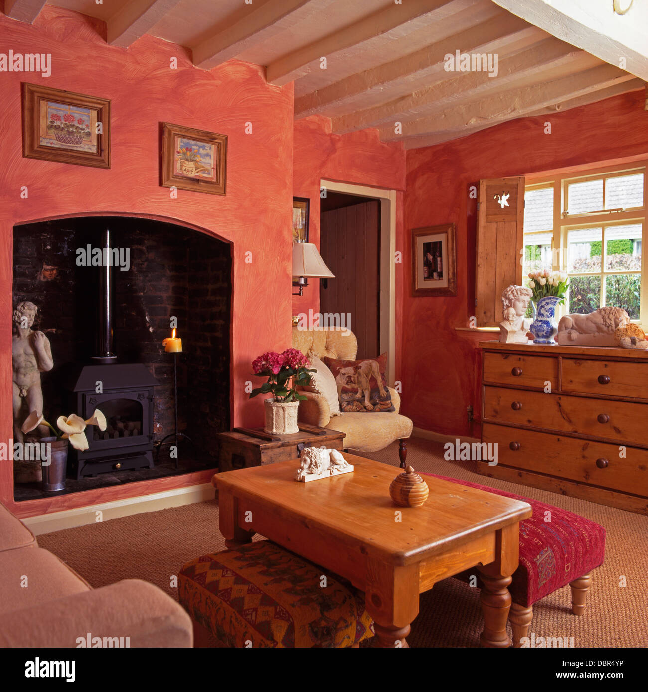 Upholstered Stools And Pine Coffee Table In Terracotta Pink Cottage Stock Photo Alamy