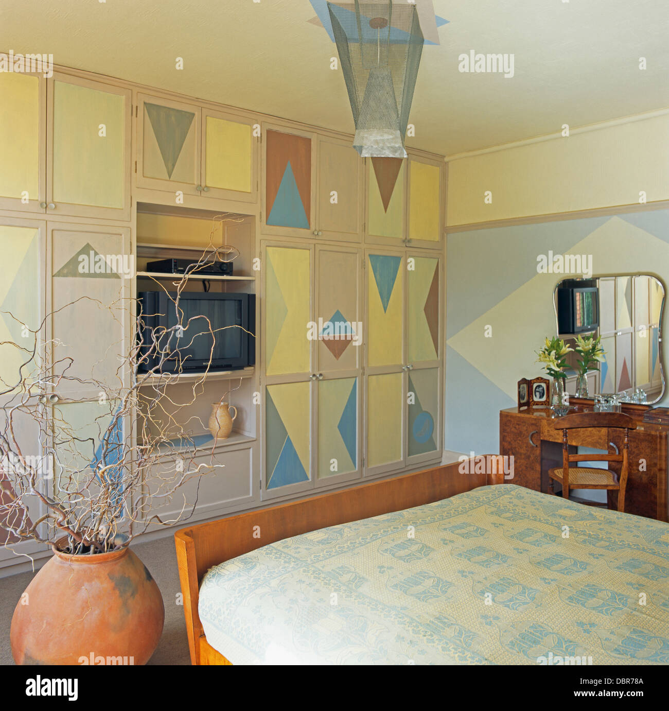 Painted Triangular Pattern On Fitted Wardrobe In Economy
