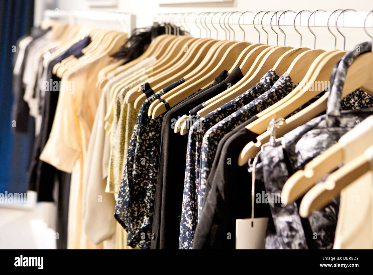Clothes hang on a shelf in a designer clothes store in Melbourne