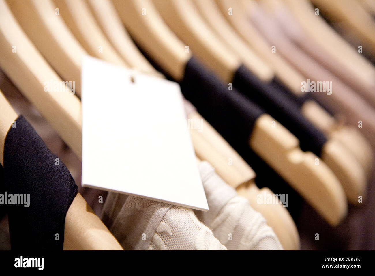 Clothes hang on a shelf in a designer clothes store in Melbourne