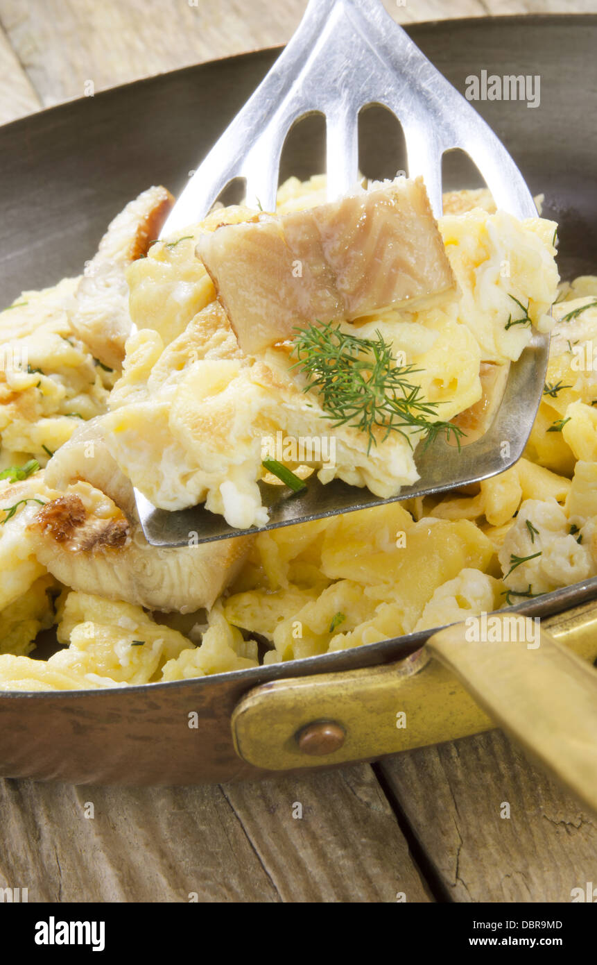 smoked eel with scrambled eggs in a pan Stock Photo Alamy