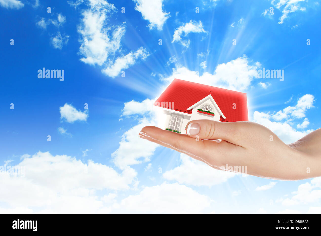 the house in hands on blue sky Stock Photo - Alamy