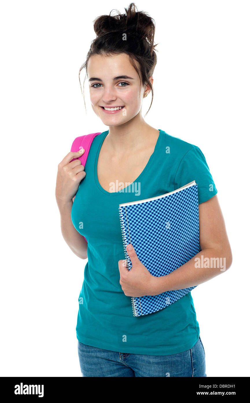 College student carrying backpack and spiral notebook Stock Photo Alamy