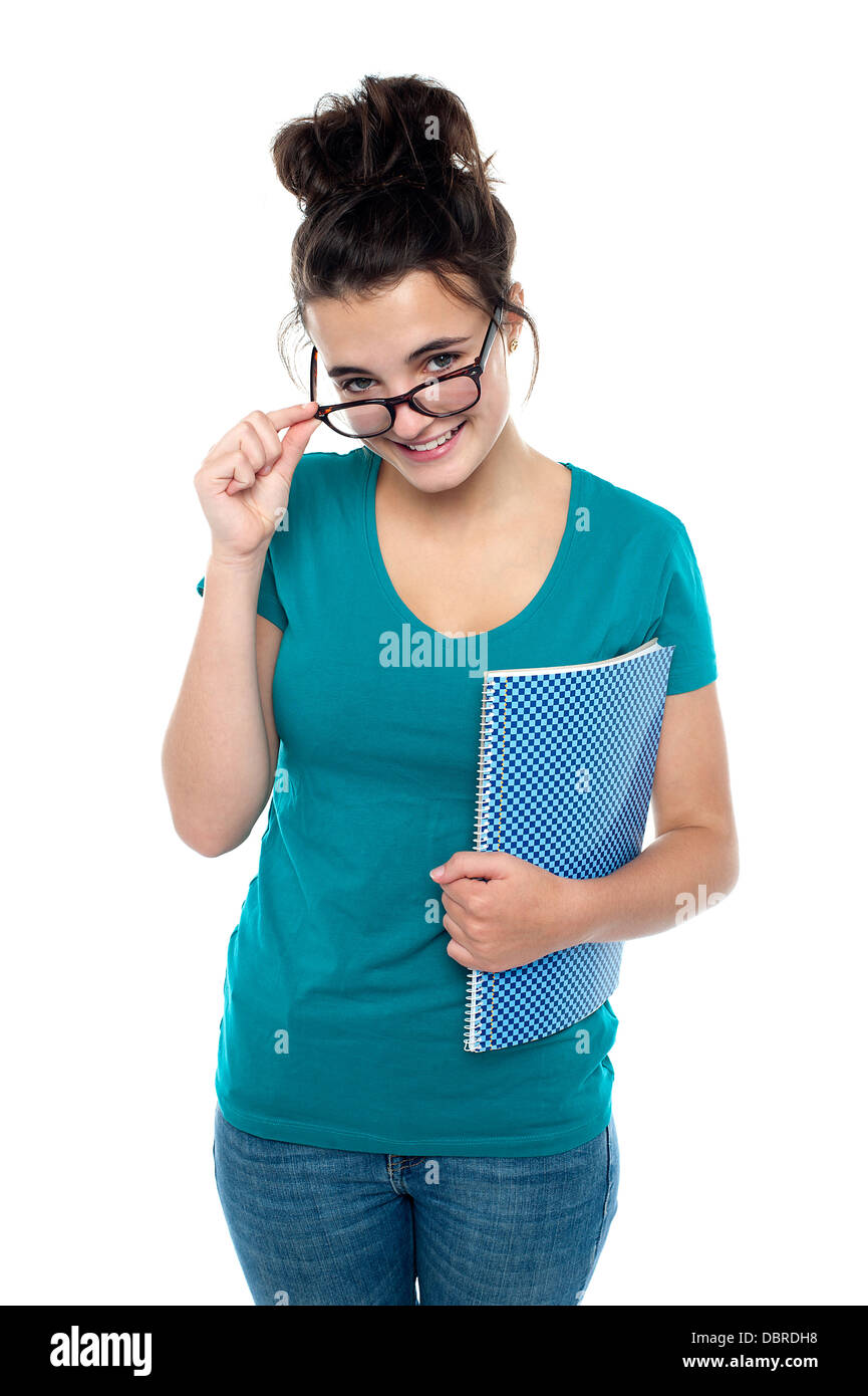 Pretty girl taking off her glasses to watch you closely Stock Photo