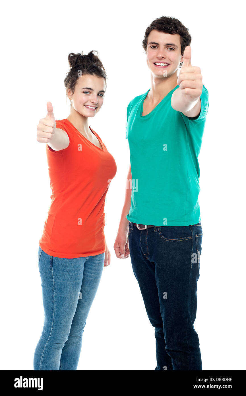Teen love couple showing thumbs up to camera Stock Photo Alamy