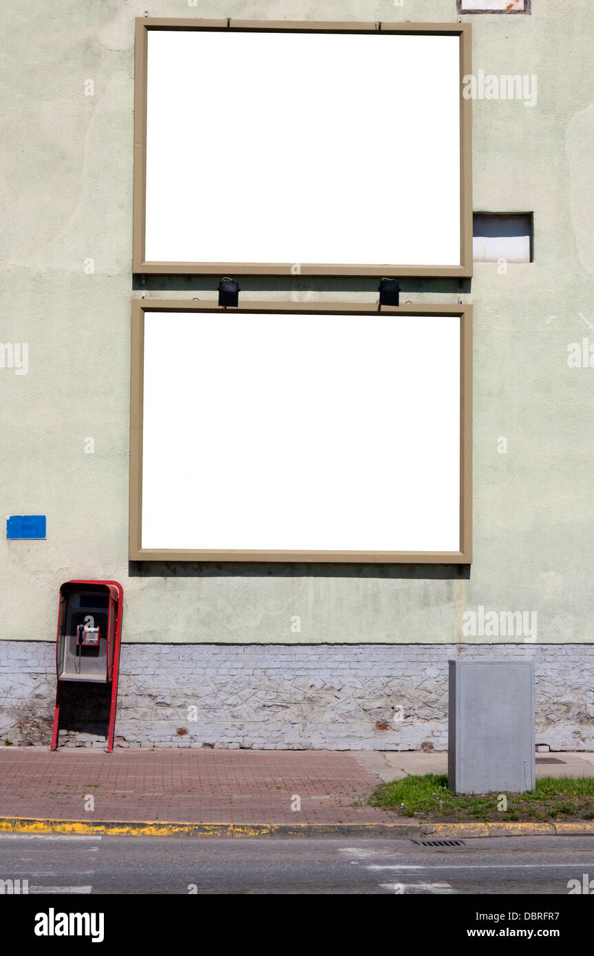 Two blank billboards on the big green wall Stock Photo - Alamy