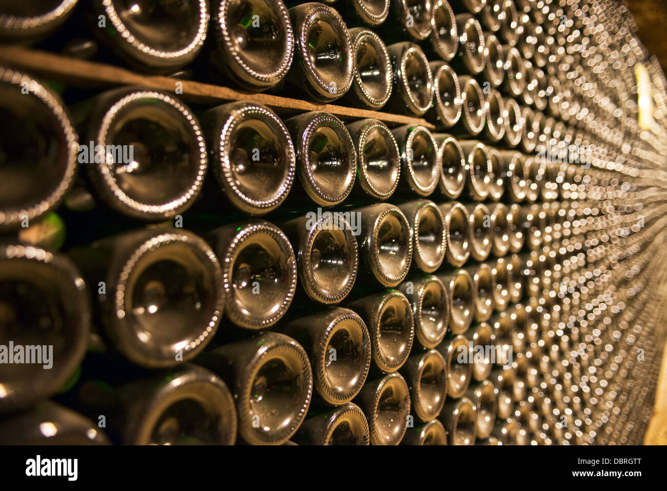 Wine bottles, racked, aging in the 'caves touristique' cellars of Vouvray in the Loire valley, Indre et Loire, France Stock Photo