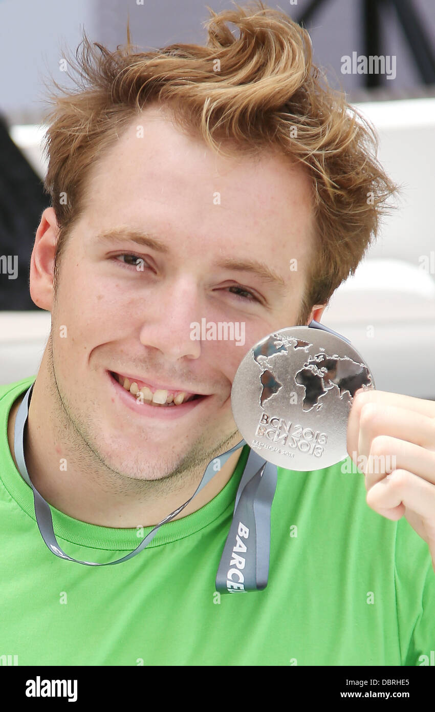 Barcelona, Spain. 03rd Aug, 2013. Silver medal winner Marco Koch of Germany poses with his silvermedal for the 200m breaststroke during the 15th FINA Swimming World Championships in Barcelona, Spain, 03 August 2013. Photo: Friso Gentsch/dpa/Alamy Live News Stock Photo
