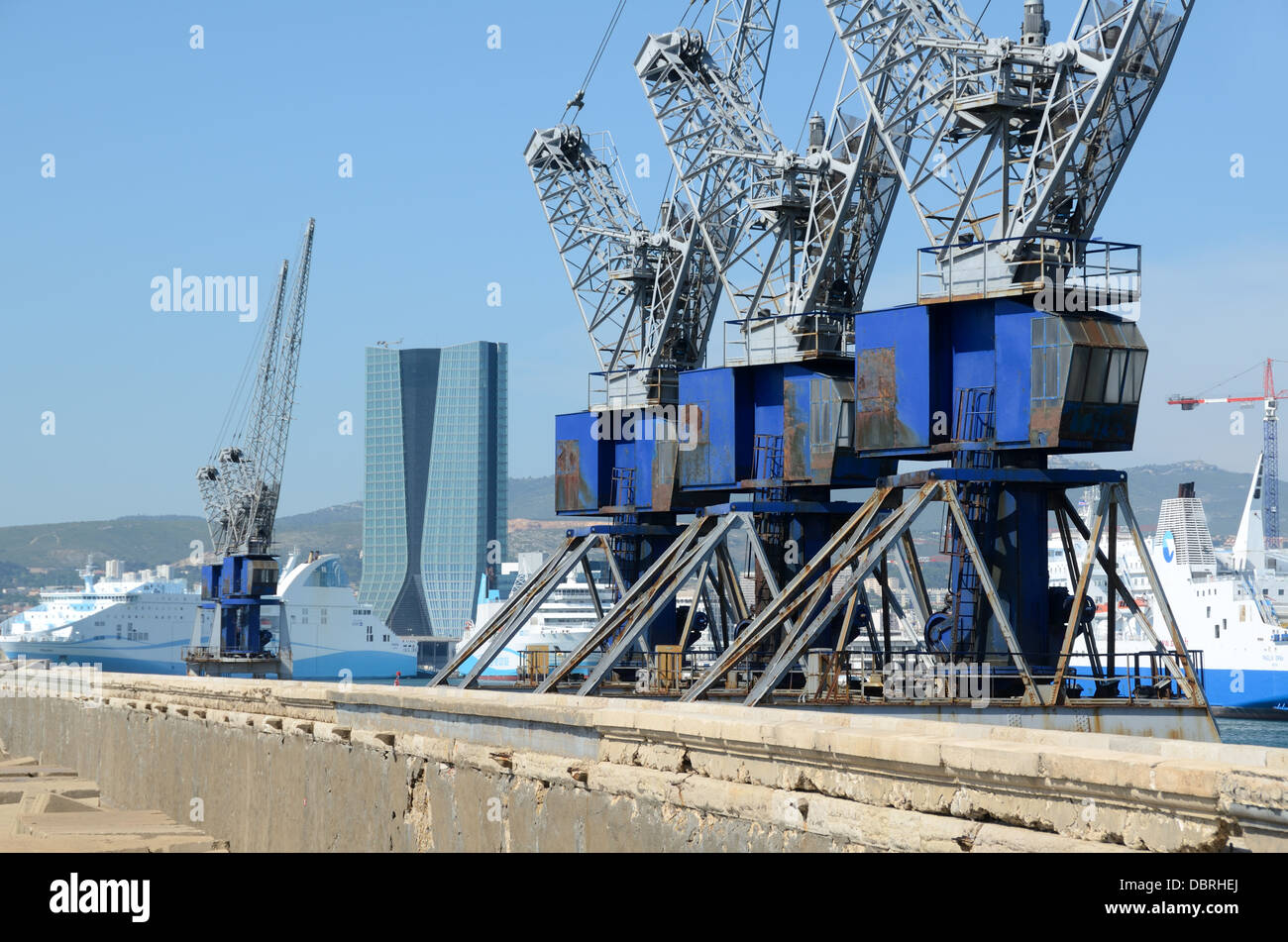 Level Luffing Cranes on Sea Wall or Break Water of Marseille Docks Port or Harbour France Stock Photo