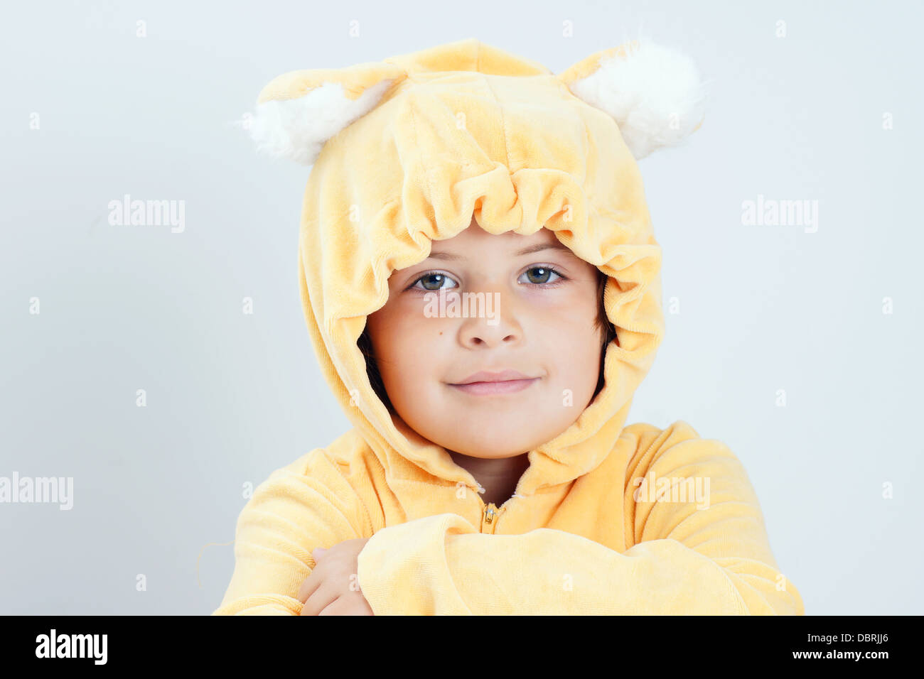 Cute little girl costumed as yellow bear Stock Photo