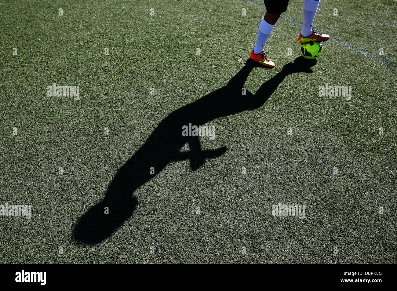soccer ball feet shadow Stock Photo
