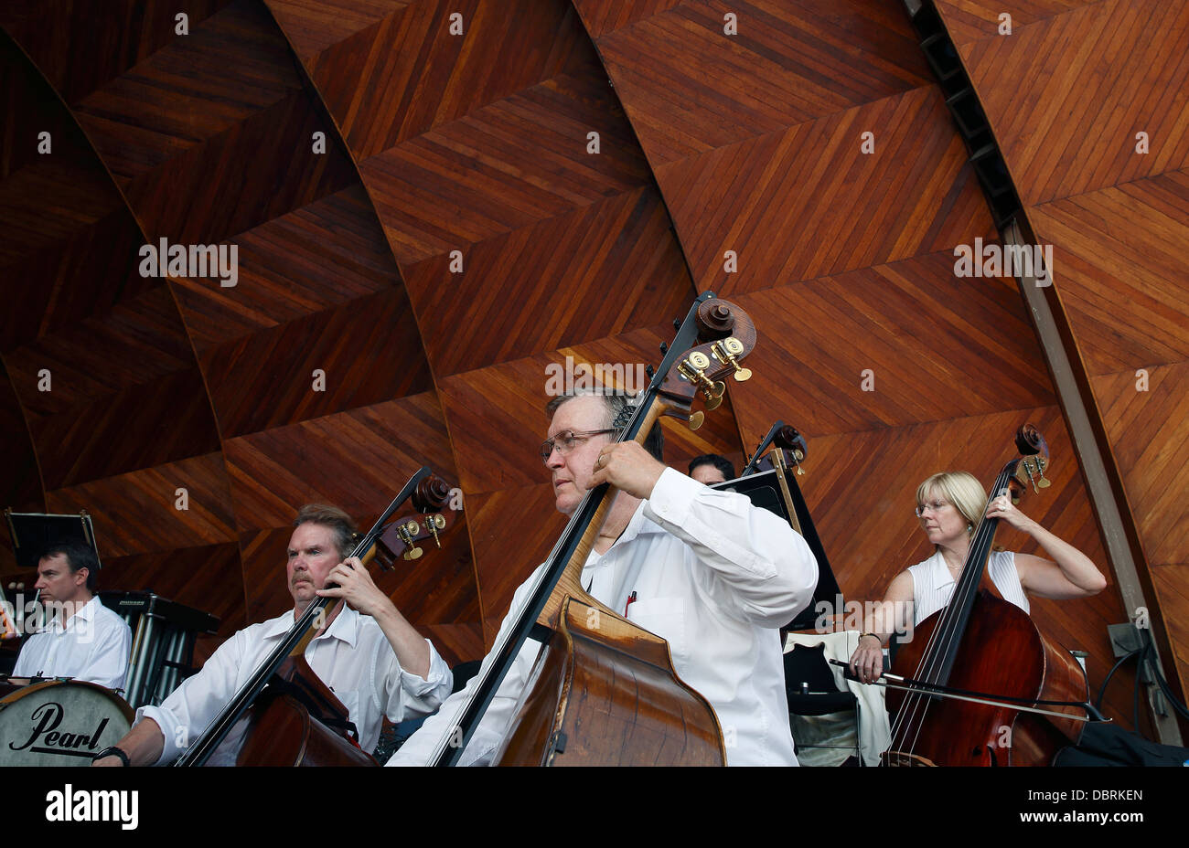 Double bass section, Boston Landmarks Orchestra at the Hatch Shell in Boston, Massachusetts Stock Photo