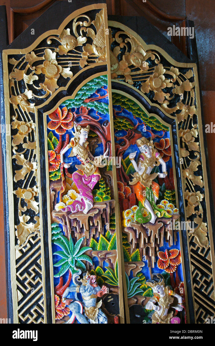 Detail of a carved and painted wooden screen or panel. Bali, Indonesia Stock Photo