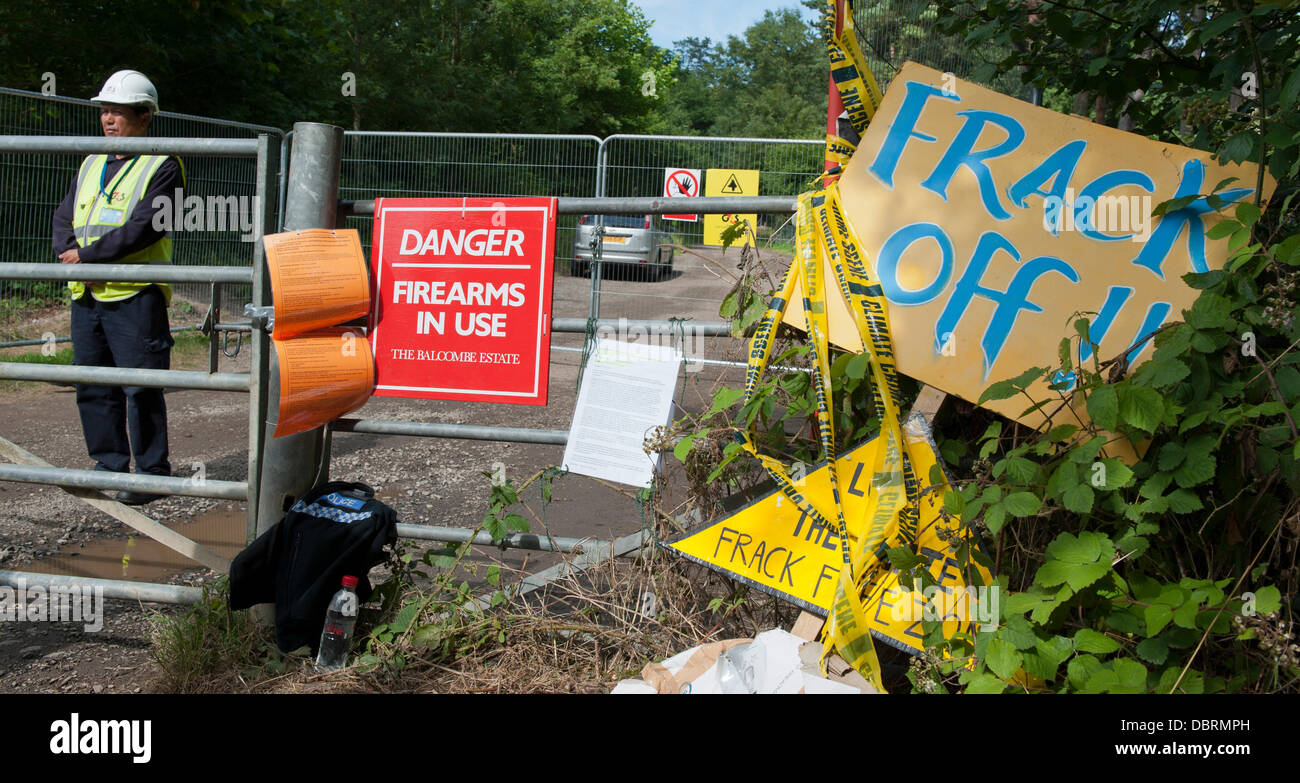Balcombe, West Sussex, UK. 03rd Aug, 2013. Security  at site entrance of Cuadrilla's exploratory drilling for oil and gas in Balcombe, Sussex. Warning reads "Danger Firearms in use, Balcombe Estate" Credit:  Prixnews/Alamy Live News. Stock Photo