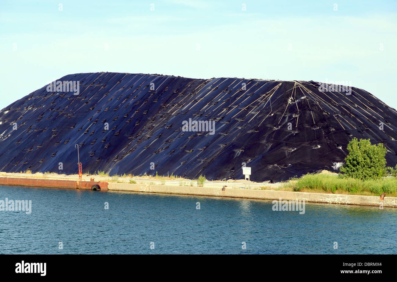 Material piled up and covered with a black membrane in Toronto, Ontario Stock Photo