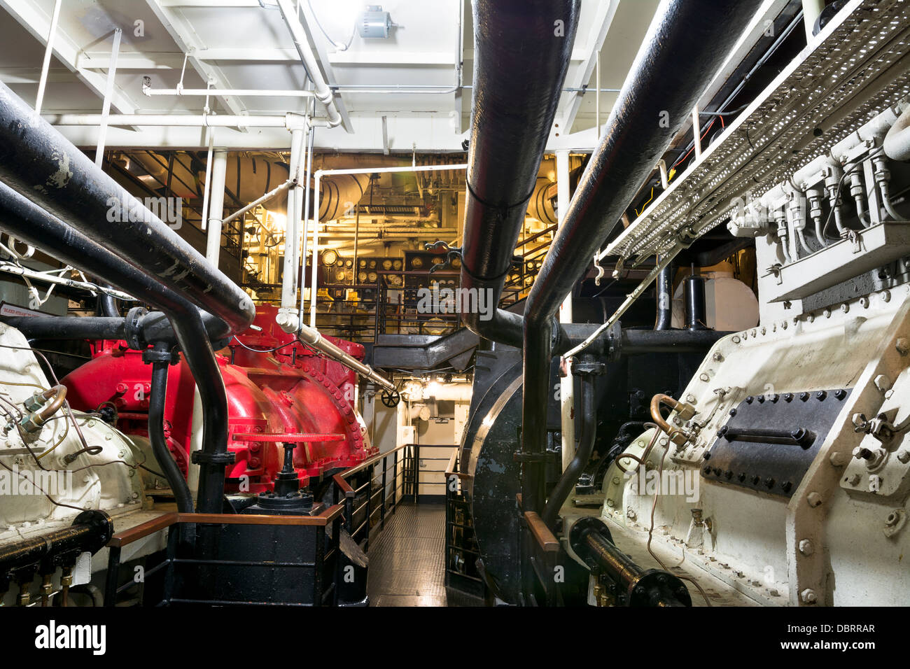 A section of the giant steam engine in the underbelly of the historic Queen Mary in Long Beach, California. Stock Photo