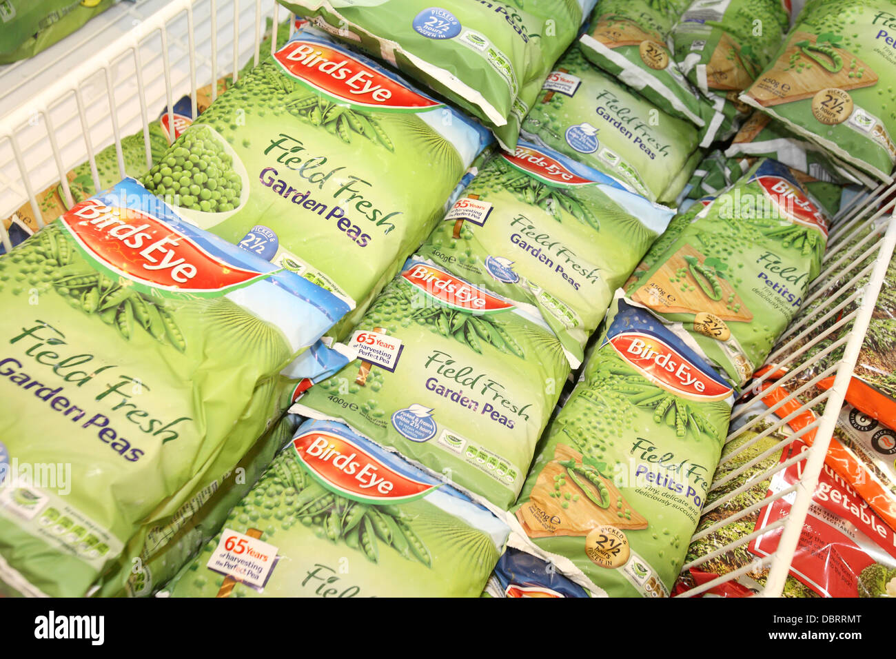 Frozen peas in a shop freezer Stock Photo