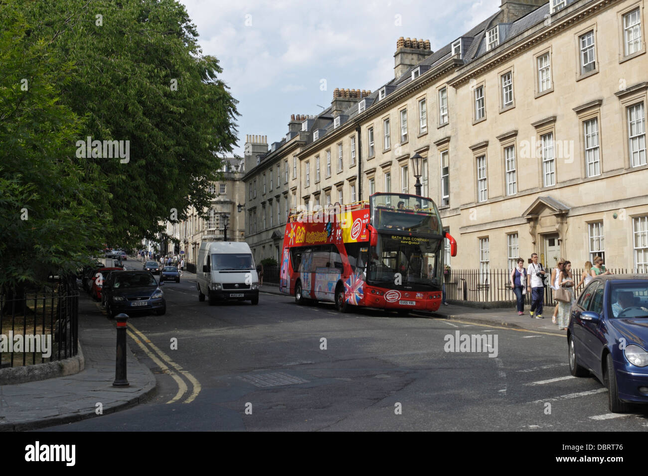 A tourist sightseeing bus in Queens square Bath England UK Stock Photo