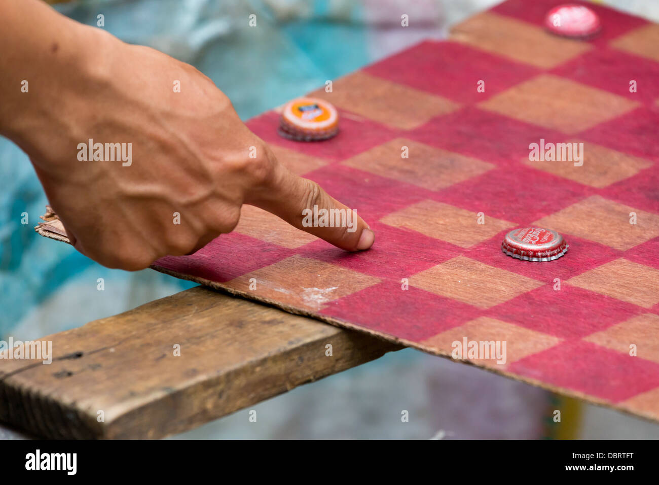 Playing a Board Game on the Klong Toey Market in Bangkok, Thailand