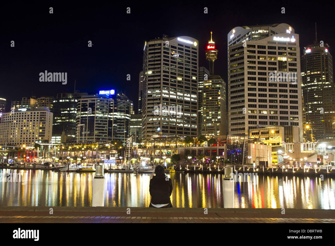 May 12, 2012 - SYDNEY, AUSTRALIA - August 04, 2013 : Sydneysider enjoying the scene of Sydney Skyline at Darling Harbour..Story Summary :.Sweet escape in Sydney.Sydney is one of the most visited city in the world. remarkable building such as Opera House, Sydney Skyline at CBD and Harbour Bridge attract a lot of tourist to come to Sydney every month. On the other side, Sydney have a gorgeous landscape and beaches...Sydneysiders might be the luckiest people in the world. They do not need to go outside from their city to have some kind of ''sweet escape''. How Sydneysiders enjoy their sweet escap Stock Photo