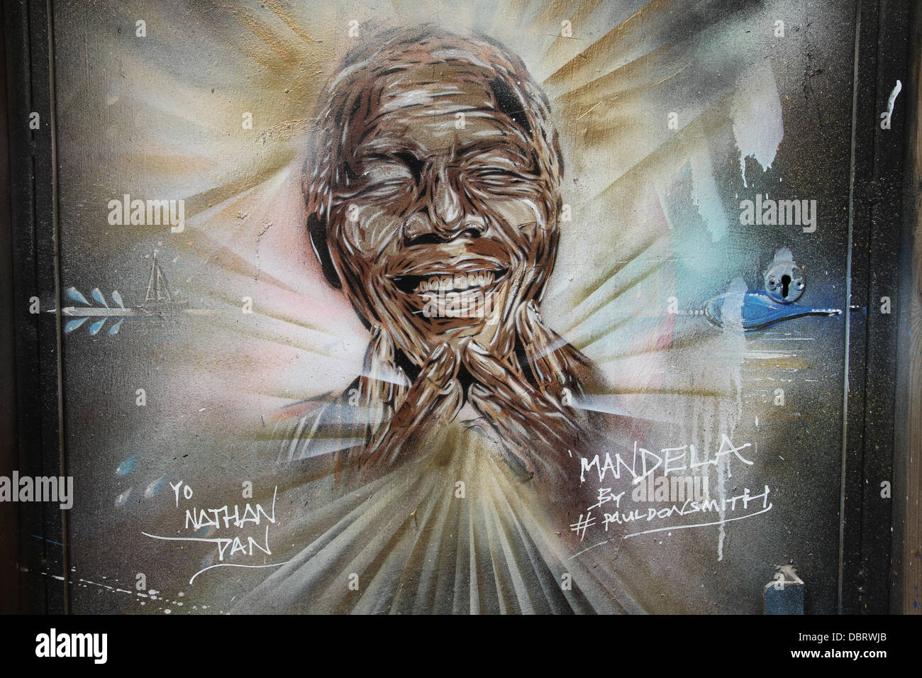 London 3 August 2013.  Portrait of 'Madiba' see on a doorway on Brick Lane in East London by street artist Paul Donsmith.  Credit David Mbiyu/Alamy Live News Stock Photo