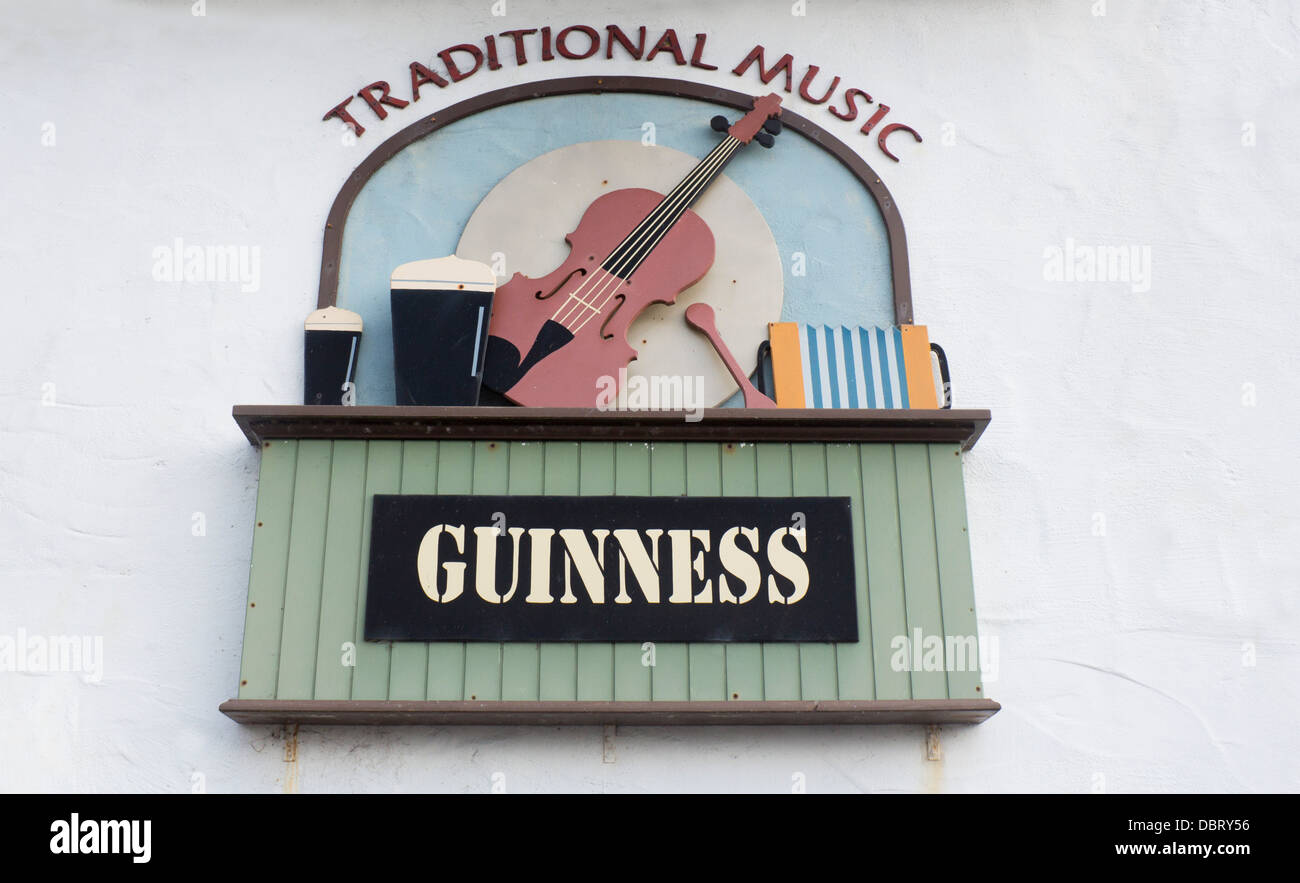 Traditional music and Guinness painted wooden sign outside pub Westport County Mayo Eire Republic of Ireland Stock Photo