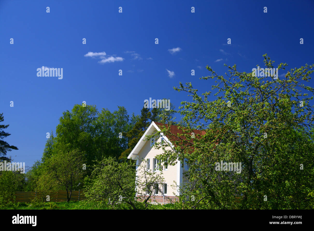 village wooden house under blue sky Stock Photo - Alamy