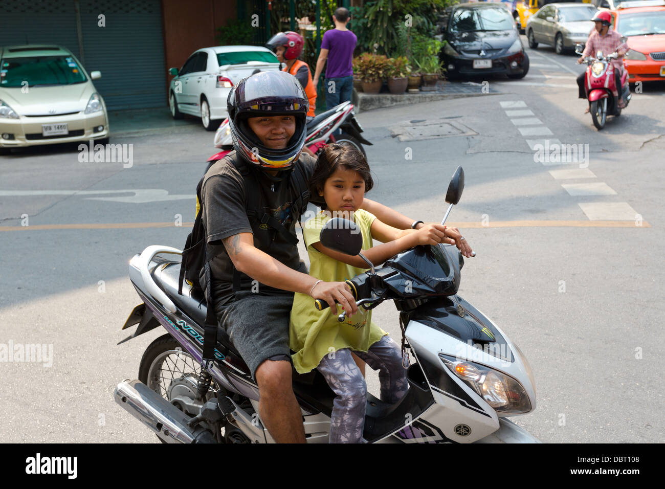 Scooter Driver With Little Girl Bangkok, Thailand Stock Photo - Alamy