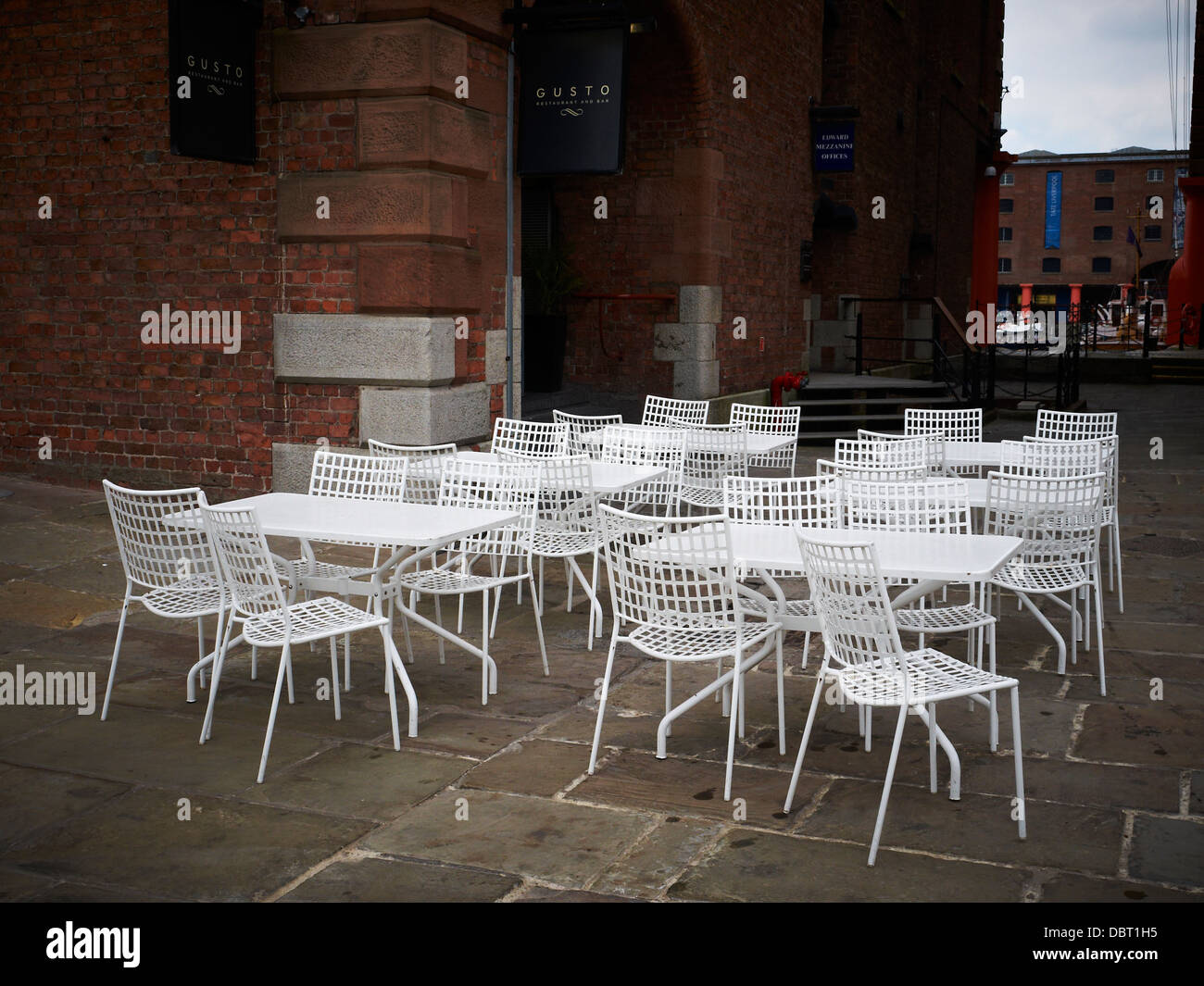 Empty pavement cafe in the Albert Dock, Liverpool UK Stock Photo